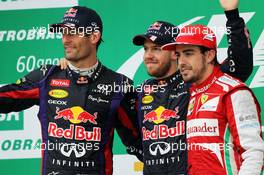 The podium (L to R): Mark Webber (AUS) Red Bull Racing, second; Sebastian Vettel (GER) Red Bull Racing, race winner; Fernando Alonso (ESP) Ferrari, third. 24.11.2013. Formula 1 World Championship, Rd 19, Brazilian Grand Prix, Sao Paulo, Brazil, Race Day.