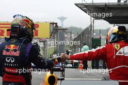 Race winner Sebastian Vettel (GER) Red Bull Racing celebrates with Fernando Alonso (ESP) Ferrari in parc ferme. 24.11.2013. Formula 1 World Championship, Rd 19, Brazilian Grand Prix, Sao Paulo, Brazil, Race Day.