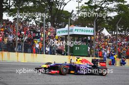 Race winner Sebastian Vettel (GER) Red Bull Racing RB9 celebrates at the end of the race. 24.11.2013. Formula 1 World Championship, Rd 19, Brazilian Grand Prix, Sao Paulo, Brazil, Race Day.