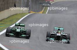 Giedo van der Garde (NDL), Caterham F1 Team and Lewis Hamilton (GBR), Mercedes Grand Prix  24.11.2013. Formula 1 World Championship, Rd 19, Brazilian Grand Prix, Sao Paulo, Brazil, Race Day.