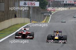 Fernando Alonso (ESP), Scuderia Ferrari and Mark Webber (AUS), Red Bull Racing  24.11.2013. Formula 1 World Championship, Rd 19, Brazilian Grand Prix, Sao Paulo, Brazil, Race Day.
