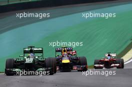 Charles Pic (FRA) Caterham CT03 leads Mark Webber (AUS) Red Bull Racing RB9. 24.11.2013. Formula 1 World Championship, Rd 19, Brazilian Grand Prix, Sao Paulo, Brazil, Race Day.