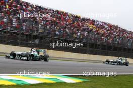 Nico Rosberg (GER) Mercedes AMG F1 W04 leads team mate Lewis Hamilton (GBR) Mercedes AMG F1 W04. 24.11.2013. Formula 1 World Championship, Rd 19, Brazilian Grand Prix, Sao Paulo, Brazil, Race Day.