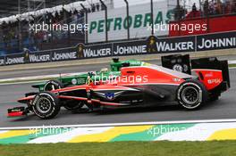 Jules Bianchi (FRA) Marussia F1 Team MR02 and Charles Pic (FRA) Caterham CT03 at the start of the race. 24.11.2013. Formula 1 World Championship, Rd 19, Brazilian Grand Prix, Sao Paulo, Brazil, Race Day.