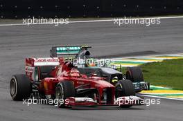Felipe Massa (BRA) Ferrari F138 leads Lewis Hamilton (GBR) Mercedes AMG F1 W04. 24.11.2013. Formula 1 World Championship, Rd 19, Brazilian Grand Prix, Sao Paulo, Brazil, Race Day.