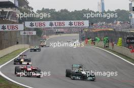 (L to R): Fernando Alonso (ESP) Ferrari F138 and Nico Rosberg (GER) Mercedes AMG F1 W04 battle for position. 24.11.2013. Formula 1 World Championship, Rd 19, Brazilian Grand Prix, Sao Paulo, Brazil, Race Day.