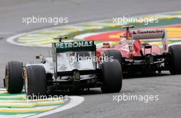 Lewis Hamilton (GBR), Mercedes Grand Prix and Felipe Massa (BRA), Scuderia Ferrari  24.11.2013. Formula 1 World Championship, Rd 19, Brazilian Grand Prix, Sao Paulo, Brazil, Race Day.