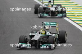 Nico Rosberg (GER) Mercedes AMG F1 W04 leads team mate Lewis Hamilton (GBR) Mercedes AMG F1 W04. 24.11.2013. Formula 1 World Championship, Rd 19, Brazilian Grand Prix, Sao Paulo, Brazil, Race Day.