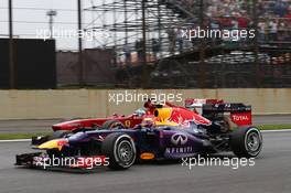 Mark Webber (AUS) Red Bull Racing RB9 and Fernando Alonso (ESP) Ferrari F138 battle for position. 24.11.2013. Formula 1 World Championship, Rd 19, Brazilian Grand Prix, Sao Paulo, Brazil, Race Day.
