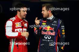 (L to R): Fernando Alonso (ESP) Ferrari and pole sitter Sebastian Vettel (GER) Red Bull Racing in parc ferme. 23.11.2013. Formula 1 World Championship, Rd 19, Brazilian Grand Prix, Sao Paulo, Brazil, Qualifying Day.