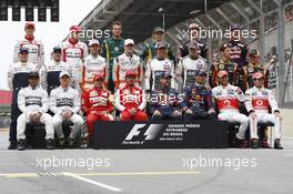 The drivers end of season group photograph (From back row (L to R)): Jules Bianchi (FRA) Marussia F1 Team; Max Chilton (GBR) Marussia F1 Team; Giedo van der Garde (NLD) Caterham F1 Team; Charles Pic (FRA) Caterham; Daniel Ricciardo (AUS) Scuderia Toro Rosso; Jean-Eric Vergne (FRA) Scuderia Toro Rosso; Valtteri Bottas (FIN) Williams; Pastor Maldonado (VEN) Williams; Adrian Sutil (GER) Sahara Force India F1; Paul di Resta (GBR) Sahara Force India F1; Esteban Gutierrez (MEX) Sauber; Nico Hulkenberg (GER) Sauber; Romain Grosjean (FRA) Lotus F1 Team; Heikki Kovalainen (FIN) Lotus F1 Team; Lewis Hamilton (GBR) Mercedes AMG F1; Nico Rosberg (GER) Mercedes AMG F1; Felipe Massa (BRA) Ferrari; Fernando Alonso (ESP) Ferrari; Sebastian Vettel (GER) Red Bull Racing; Mark Webber (AUS) Red Bull Racing; Jenson Button (GBR) McLaren; Sergio Perez (MEX) McLaren. 24.11.2013. Formula 1 World Championship, Rd 19, Brazilian Grand Prix, Sao Paulo, Brazil, Race Day.