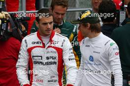 (L to R): Jules Bianchi (FRA) Marussia F1 Team and Charles Pic (FRA) Caterham on the drivers parade. 24.11.2013. Formula 1 World Championship, Rd 19, Brazilian Grand Prix, Sao Paulo, Brazil, Race Day.