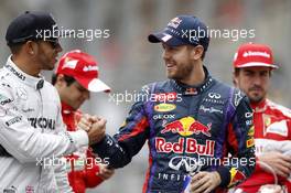 (L to R): Lewis Hamilton (GBR) Mercedes AMG F1 with Sebastian Vettel (GER) Red Bull Racing on the drivers parade. 24.11.2013. Formula 1 World Championship, Rd 19, Brazilian Grand Prix, Sao Paulo, Brazil, Race Day.