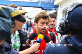 Fernando Alonso (ESP) Ferrari with the media. 24.11.2013. Formula 1 World Championship, Rd 19, Brazilian Grand Prix, Sao Paulo, Brazil, Race Day.