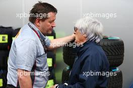 (L to R): Paul Hembery (GBR) Pirelli Motorsport Director with Bernie Ecclestone (GBR) CEO Formula One Group (FOM). 24.11.2013. Formula 1 World Championship, Rd 19, Brazilian Grand Prix, Sao Paulo, Brazil, Race Day.