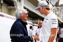 (L to R): Bernie Ecclestone (GBR) CEO Formula One Group (FOM) with Nico Rosberg (GER) Mercedes AMG F1. 24.11.2013. Formula 1 World Championship, Rd 19, Brazilian Grand Prix, Sao Paulo, Brazil, Race Day.