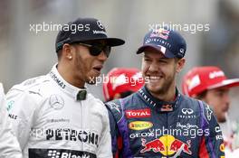 (L to R): Lewis Hamilton (GBR) Mercedes AMG F1 with Sebastian Vettel (GER) Red Bull Racing on the drivers parade. 24.11.2013. Formula 1 World Championship, Rd 19, Brazilian Grand Prix, Sao Paulo, Brazil, Race Day.