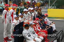 The drivers end of season group photograph (From back row (L to R)): Jules Bianchi (FRA) Marussia F1 Team; Max Chilton (GBR) Marussia F1 Team; Giedo van der Garde (NLD) Caterham F1 Team; Charles Pic (FRA) Caterham; Daniel Ricciardo (AUS) Scuderia Toro Rosso; Jean-Eric Vergne (FRA) Scuderia Toro Rosso; Valtteri Bottas (FIN) Williams; Pastor Maldonado (VEN) Williams; Adrian Sutil (GER) Sahara Force India F1; Paul di Resta (GBR) Sahara Force India F1; Esteban Gutierrez (MEX) Sauber; Nico Hulkenberg (GER) Sauber; Romain Grosjean (FRA) Lotus F1 Team; Heikki Kovalainen (FIN) Lotus F1 Team; Lewis Hamilton (GBR) Mercedes AMG F1; Nico Rosberg (GER) Mercedes AMG F1; Felipe Massa (BRA) Ferrari; Fernando Alonso (ESP) Ferrari; Sebastian Vettel (GER) Red Bull Racing; Mark Webber (AUS) Red Bull Racing; Jenson Button (GBR) McLaren; Sergio Perez (MEX) McLaren. 24.11.2013. Formula 1 World Championship, Rd 19, Brazilian Grand Prix, Sao Paulo, Brazil, Race Day.