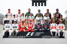 The drivers end of season group photograph (From back row (L to R)): Jules Bianchi (FRA) Marussia F1 Team; Max Chilton (GBR) Marussia F1 Team; Giedo van der Garde (NLD) Caterham F1 Team; Charles Pic (FRA) Caterham; Daniel Ricciardo (AUS) Scuderia Toro Rosso; Jean-Eric Vergne (FRA) Scuderia Toro Rosso; Valtteri Bottas (FIN) Williams; Pastor Maldonado (VEN) Williams; Adrian Sutil (GER) Sahara Force India F1; Paul di Resta (GBR) Sahara Force India F1; Esteban Gutierrez (MEX) Sauber; Nico Hulkenberg (GER) Sauber; Romain Grosjean (FRA) Lotus F1 Team; Heikki Kovalainen (FIN) Lotus F1 Team; Lewis Hamilton (GBR) Mercedes AMG F1; Nico Rosberg (GER) Mercedes AMG F1; Felipe Massa (BRA) Ferrari; Fernando Alonso (ESP) Ferrari; Sebastian Vettel (GER) Red Bull Racing; Mark Webber (AUS) Red Bull Racing; Jenson Button (GBR) McLaren; Sergio Perez (MEX) McLaren. 24.11.2013. Formula 1 World Championship, Rd 19, Brazilian Grand Prix, Sao Paulo, Brazil, Race Day.