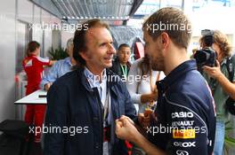 (L to R): Emerson Fittipaldi (BRA) with Sebastian Vettel (GER) Red Bull Racing. 24.11.2013. Formula 1 World Championship, Rd 19, Brazilian Grand Prix, Sao Paulo, Brazil, Race Day.