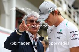 (L to R): Bernie Ecclestone (GBR) CEO Formula One Group (FOM) with Nico Rosberg (GER) Mercedes AMG F1. 24.11.2013. Formula 1 World Championship, Rd 19, Brazilian Grand Prix, Sao Paulo, Brazil, Race Day.