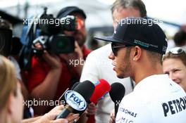 Lewis Hamilton (GBR) Mercedes AMG F1 with the media. 21.11.2013. Formula 1 World Championship, Rd 19, Brazilian Grand Prix, Sao Paulo, Brazil, Preparation Day.