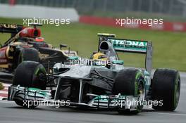 Lewis Hamilton (GBR) Mercedes AMG F1 W04 leads Kimi Raikkonen (FIN) Lotus F1 E21. 07.06.2013. Formula 1 World Championship, Rd 7, Canadian Grand Prix, Montreal, Canada, Practice Day.