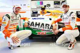 (L to R): Paul di Resta (GBR) Sahara Force India F1 and Adrian Sutil (GER) Sahara Force India F1 celebrate the 100th GP for the Sahara Force India F1 Team. 07.06.2013. Formula 1 World Championship, Rd 7, Canadian Grand Prix, Montreal, Canada, Practice Day.