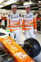 (L to R): Adrian Sutil (GER) Sahara Force India F1 and Paul di Resta (GBR) Sahara Force India F1 celebrate the 100th GP for the Sahara Force India F1 Team. 07.06.2013. Formula 1 World Championship, Rd 7, Canadian Grand Prix, Montreal, Canada, Practice Day.