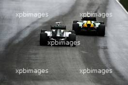 Giedo van der Garde (NLD) Caterham CT03 leads Lewis Hamilton (GBR) Mercedes AMG F1 W04. 07.06.2013. Formula 1 World Championship, Rd 7, Canadian Grand Prix, Montreal, Canada, Practice Day.