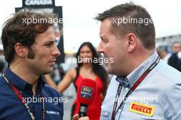 Paul Hembery (GBR) Pirelli Motorsport Director with Luca Filippi (ITA) Sky Sports F1 TV Presenter. 09.06.2013. Formula 1 World Championship, Rd 7, Canadian Grand Prix, Montreal, Canada, Race Day.