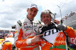 (L to R): Adrian Sutil (GER) Sahara Force India F1 and Neil Dickie (GBR) Sahara Force India F1 Team celebrate 100 Grands Prix for Sahara Force India F1 Team on the grid. 09.06.2013. Formula 1 World Championship, Rd 7, Canadian Grand Prix, Montreal, Canada, Race Day.