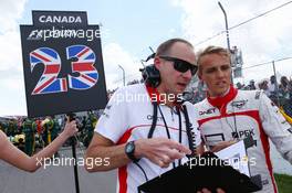Max Chilton (GBR) Marussia F1 Team with Gary Gannon (GBR) Marussia F1 Team Race Engineer on the grid. 09.06.2013. Formula 1 World Championship, Rd 7, Canadian Grand Prix, Montreal, Canada, Race Day.