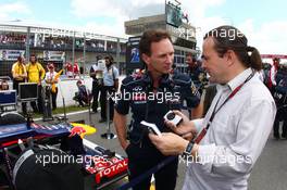 Christian Horner (GBR) Red Bull Racing Team Principal with Adam Cooper (GBR) Journalist on the grid. 09.06.2013. Formula 1 World Championship, Rd 7, Canadian Grand Prix, Montreal, Canada, Race Day.