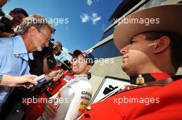 Race winner Sebastian Vettel (GER) Red Bull Racing with Eddie Jordan (IRE) BBC Television Pundit (Left). 09.06.2013. Formula 1 World Championship, Rd 7, Canadian Grand Prix, Montreal, Canada, Race Day.
