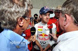 Race winner Sebastian Vettel (GER) Red Bull Racing with Eddie Jordan (IRE) BBC Television Pundit (Left) and Martin Brundle (GBR) Sky Sports Commentator (Right). 09.06.2013. Formula 1 World Championship, Rd 7, Canadian Grand Prix, Montreal, Canada, Race Day.