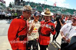 Race winner Sebastian Vettel (GER) Red Bull Racing with Canadian Mounted Policemen. 09.06.2013. Formula 1 World Championship, Rd 7, Canadian Grand Prix, Montreal, Canada, Race Day.