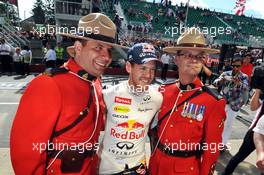 Race winner Sebastian Vettel (GER) Red Bull Racing with Canadian Mounted Policemen. 09.06.2013. Formula 1 World Championship, Rd 7, Canadian Grand Prix, Montreal, Canada, Race Day.