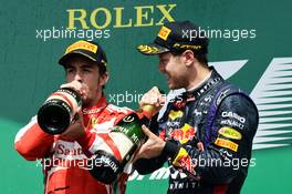(L to R): Fernando Alonso (ESP) Ferrari celebrates his second position on the podium with race winner Sebastian Vettel (GER) Red Bull Racing. 09.06.2013. Formula 1 World Championship, Rd 7, Canadian Grand Prix, Montreal, Canada, Race Day.