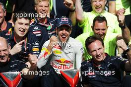 Race winner Sebastian Vettel (GER) Red Bull Racing celebrates with the team. 09.06.2013. Formula 1 World Championship, Rd 7, Canadian Grand Prix, Montreal, Canada, Race Day.