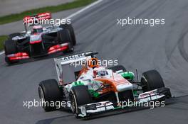 Paul di Resta (GBR) Sahara Force India VJM06 leads Jenson Button (GBR) McLaren MP4-28. 09.06.2013. Formula 1 World Championship, Rd 7, Canadian Grand Prix, Montreal, Canada, Race Day.