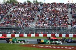 Charles Pic (FRA) Caterham CT03 leads Giedo van der Garde (NLD) Caterham CT03 at the start of the race. 09.06.2013. Formula 1 World Championship, Rd 7, Canadian Grand Prix, Montreal, Canada, Race Day.