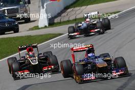 Daniel Ricciardo (AUS) Scuderia Toro Rosso STR8 leads Kimi Raikkonen (FIN) Lotus F1 E21. 09.06.2013. Formula 1 World Championship, Rd 7, Canadian Grand Prix, Montreal, Canada, Race Day.