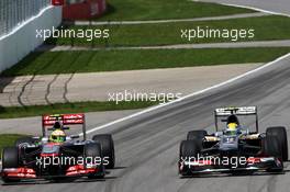 (L to R): Sergio Perez (MEX) McLaren MP4-28 and Esteban Gutierrez (MEX) Sauber C32 battle for position. 09.06.2013. Formula 1 World Championship, Rd 7, Canadian Grand Prix, Montreal, Canada, Race Day.