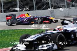 Mark Webber (AUS) Red Bull Racing RB9 follows Pastor Maldonado (VEN) Williams FW35. 09.06.2013. Formula 1 World Championship, Rd 7, Canadian Grand Prix, Montreal, Canada, Race Day.