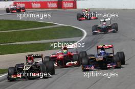 Kimi Raikkonen (FIN) Lotus F1 E21 leads Felipe Massa (BRA) Ferrari F138 and Daniel Ricciardo (AUS) Scuderia Toro Rosso STR8. 09.06.2013. Formula 1 World Championship, Rd 7, Canadian Grand Prix, Montreal, Canada, Race Day.