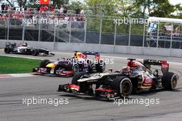 Kimi Raikkonen (FIN) Lotus F1 E21 is lapped by Sebastian Vettel (GER) Red Bull Racing RB9. 09.06.2013. Formula 1 World Championship, Rd 7, Canadian Grand Prix, Montreal, Canada, Race Day.