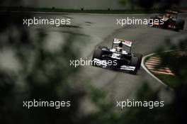 Valtteri Bottas (FIN) Williams FW35 leads Kimi Raikkonen (FIN) Lotus F1 E21. 08.06.2013. Formula 1 World Championship, Rd 7, Canadian Grand Prix, Montreal, Canada, Qualifying Day.