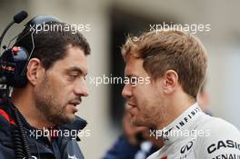 Sebastian Vettel (GER) Red Bull Racing with Guillaume Rocquelin (ITA) Red Bull Racing Race Engineer.