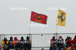 Ferrari flags in the grandstands.
